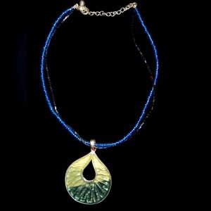 Gorgeous women's beaded necklace with a beautiful pendant attached